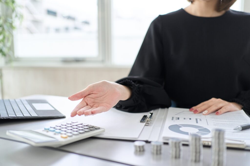 Hand Of A Woman Who Guides Investment