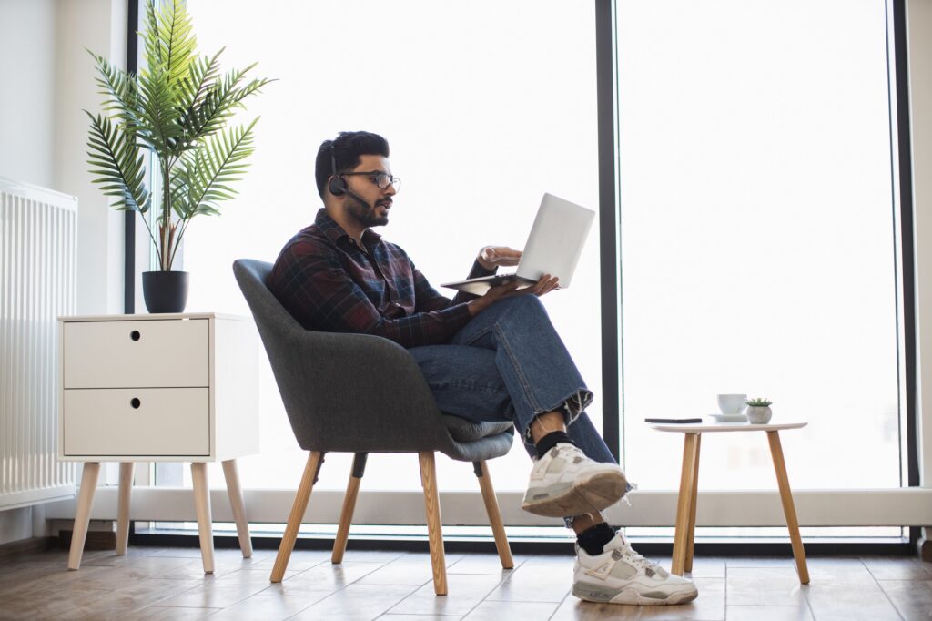 Indian Male In Virtual Meeting From Home Office Setting